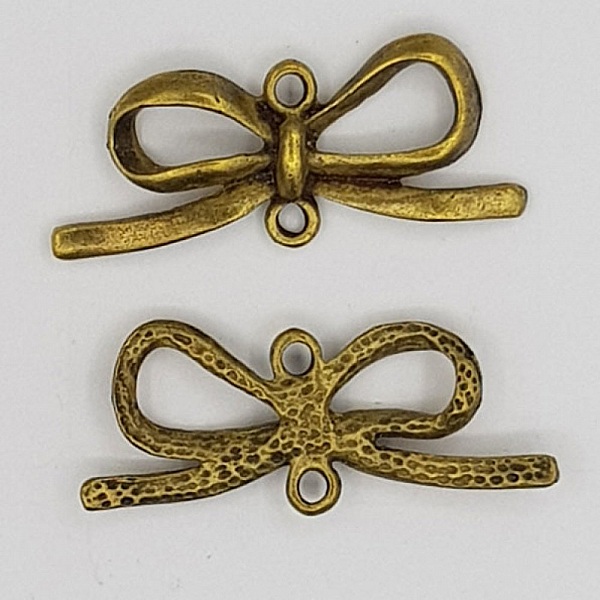 Breloque N&oelig;ud N&deg;16 breloque noeud papillon ruban en m&eacute;tal bronze