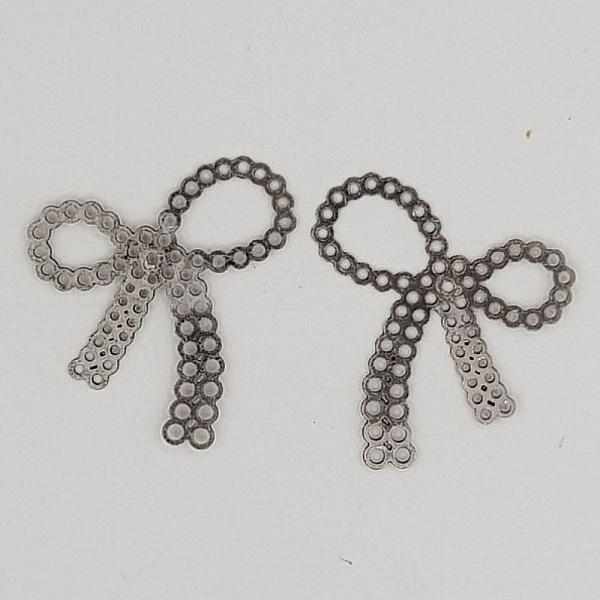 Breloque N&oelig;ud N&deg;24 breloque noeud papillon ruban en m&eacute;tal Argent