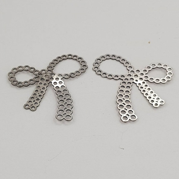 Breloque N&oelig;ud N&deg;24 breloque noeud papillon ruban en m&eacute;tal Argent