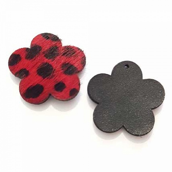 Fleur en fourrure rouge à pois noirs doublée cuir.