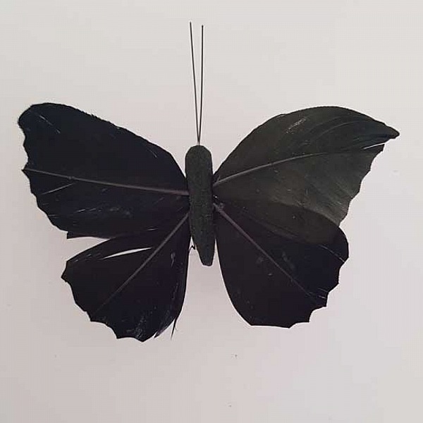 Papillon noir aux ailes de plumes mont&eacute;s sur tige PM