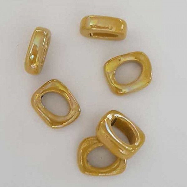 Perle c&eacute;ramique passe cuir ovale 18 mm Jaune Nacre