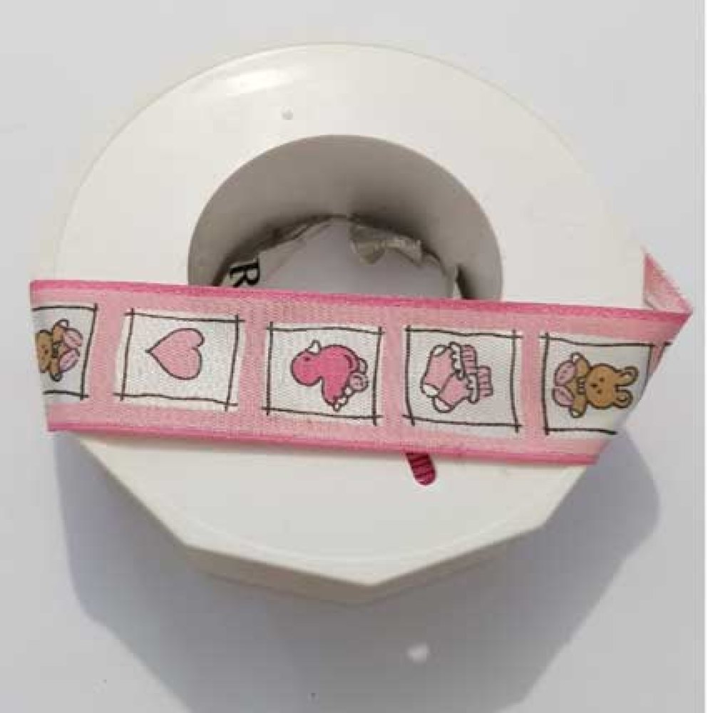 Ruban galon 25 mm avec motifs enfant roses sur bobine.