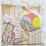 Carte d'amiti&eacute;s  en scrap oiseau dans son nid de fleurs suspendu sur fond multicolore rose, jaune, fris graphique