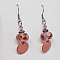 boucles d'oreille de createur couleur saumon ros&eacute; avec perle transparentes fait &agrave; la main