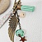 Porte cl&eacute; ou bijou de sac avec pendentif aile d'ange couleur bronze dans les tons pastels tendres