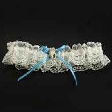 Jarreti&egrave;re ivoire dentelle coquillage th&egrave;me mer