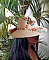 Chapeau en paille enduite peint à la main motifs fleurs.