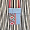 Pochette téléphone en jean recyclé avec bandoulière rouge.