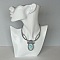 Collier en micro-macram&eacute; gris taupe/bleu givr&eacute; avec en pi&egrave;ce centrale une pierre gemme naturelle aux douces nuances de blanc et de bleu clair.