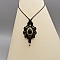 collier noir en micro-macram&eacute; avec une obsidienne sertie de m&eacute;tal dor&eacute;