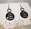 Boucles d'oreilles graphiques en bois noyer motif cage oiseau.