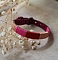 Bracelet en cuir fuchsia style boh&egrave;me tiss&eacute; de fils de coton tons p&ecirc;ches et roses