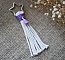 Porte-clé macramé étoile en coton avec pompon violet.