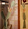 Suspension macramé vert pour ustensiles de cuisine en bois.