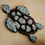 D&eacute;coration Tortue marine en tissage de laine noir et vert