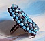 Bague Na&iuml;ade brod&eacute;e avec un cabochon facett&eacute; Turquoise, chatons, toupies en Cristal de Swarovski, rocailles sur une bague de couleur Bronze et sur du cuir vachette Camel 