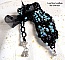 Bracelet Prestige avec des facettes noires et bleu et un ruban organza