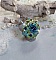 Bague Esp&eacute;rance mont&eacute;e avec toupies Aquamarine AB, Blue Zircon, Capri Blue, Olivine AB, Cristal avec des facettes entrelac&eacute;es avec des rocailles. Elle s&rsquo;adaptera parfaitement &agrave; votre doigt