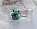 Bague Esp&eacute;rance mont&eacute;e avec toupies Aquamarine AB, Blue Zircon, Capri Blue, Olivine AB, Cristal avec des facettes entrelac&eacute;es avec des rocailles. Elle s&rsquo;adaptera parfaitement &agrave; votre doigt