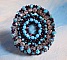 Bague Na&iuml;ade brod&eacute;e avec un cabochon facett&eacute; Turquoise, chatons, toupies en Cristal de Swarovski, rocailles sur une bague de couleur Bronze et sur du cuir vachette Camel 