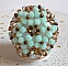 Bague N&eacute;nuphar mont&eacute;e avec toupies Menthe et Light Smoked Topaz en Cristal de Swarovski, facettes en Verre de Boh&egrave;me de m&ecirc;me couleur que les cristaux, entrecrois&eacute;es avec des rocailles Dark Bronze 