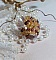 Bague Soleil mont&eacute;e avec des toupies en Cristal de Swarovski aux couleurs Topaze, Gold et Marron &agrave; laquelle s&rsquo;ajoute des facettes en Verre de Boh&egrave;me. Les perles s&rsquo;entrelacent avec les rocailles Dor&eacute;es