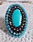Bague Turquoise au style Am&eacute;rindien avec un cabochon ovale en pierre de gemme : le Turquoise lui-m&ecirc;me orn&eacute; de toupies en Cristal, s&rsquo;ajoute des rocailles en verre Miyuki et tch&egrave;que sur une bague Bronze