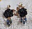 Boucles d'oreilles artisanales noires et dorées style attrape-rêves.
