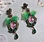 BO C&oelig;ur d&rsquo;Anges avec des cabochons d&rsquo;un petit ange orn&eacute;s d&rsquo;une cha&icirc;ne strass, navettes, poires et cabochons en Cristal. S&rsquo;ajoute des rubans organza sur pendentifs et clous en forme de fleurs.