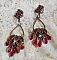 BO Irr&eacute;sistible Rubis mont&eacute;es sur des chandeliers avec des cristaux de Swarovski