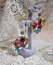 Boucles d'oreilles artisanales fleuries en argent et pierres naturelles.