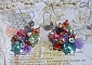 Boucles d'oreilles artisanales fleuries en argent et pierres naturelles.