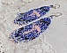 Boucles d'oreilles pendantes flamants roses en perles de rocailles.