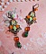 BO F&eacute;es Aloes Potiron repr&eacute;sentant un cabochon d&rsquo;une f&eacute;e aux couleurs roses oranges/Vert Anis, cristaux, estampes et dormeuses Bronze en laiton. Une inspiration d&rsquo;un &ecirc;tre l&eacute;gendaire.