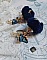 Boucles d'oreilles clips avec pompons bleus et perles Swarovski.