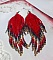 Boucles d'oreilles artisanales en perles rouges, bleues et dorées.