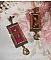 Boucles d'oreilles vintage bordeaux avec cristaux et métal bronze.