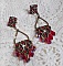 BO Irr&eacute;sistible Rubis mont&eacute;es sur des chandeliers avec des cristaux de Swarovski