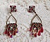 BO Irr&eacute;sistible Rubis mont&eacute;es sur des chandeliers avec des cristaux de Swarovski