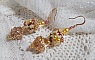 Boucles d'oreilles artisanales en perles jaunes et laiton doré.