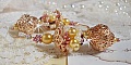 Boucles d'oreilles artisanales en perles dorées et laiton doré.