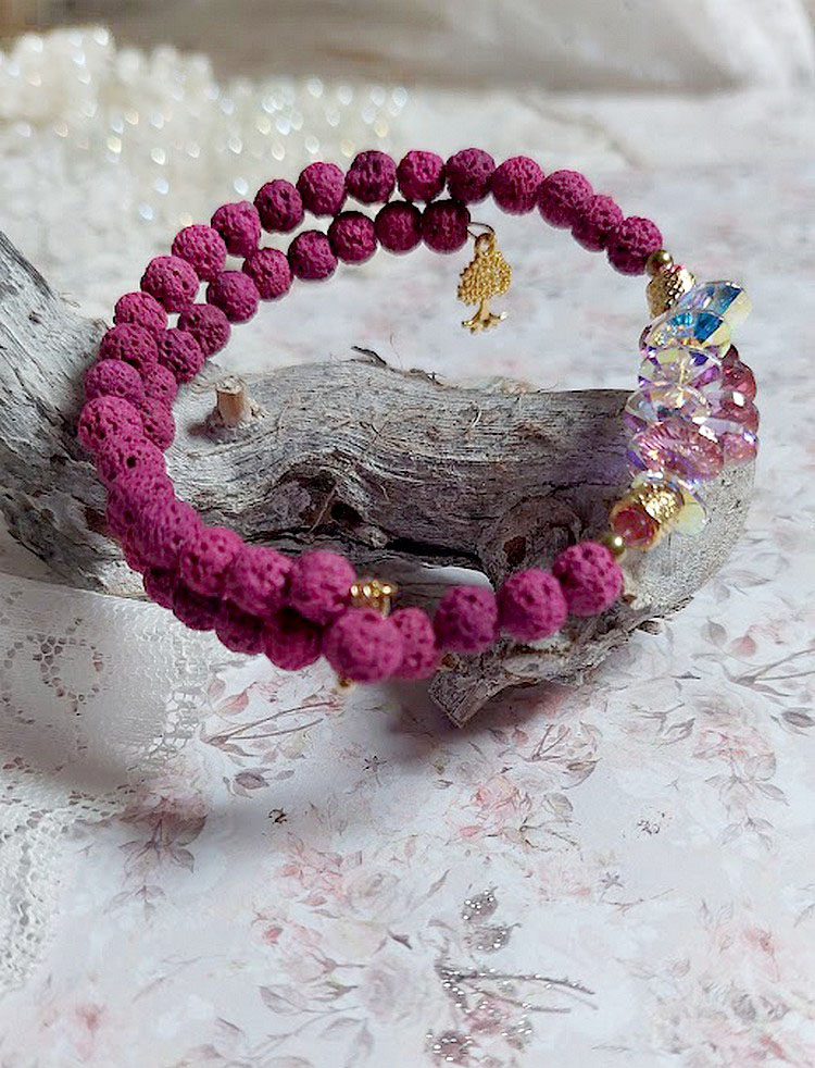 Bracelet bohème chic en pierre de lave rose framboise.