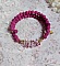 Bracelet deux rangs en pierres de lave rose framboise.