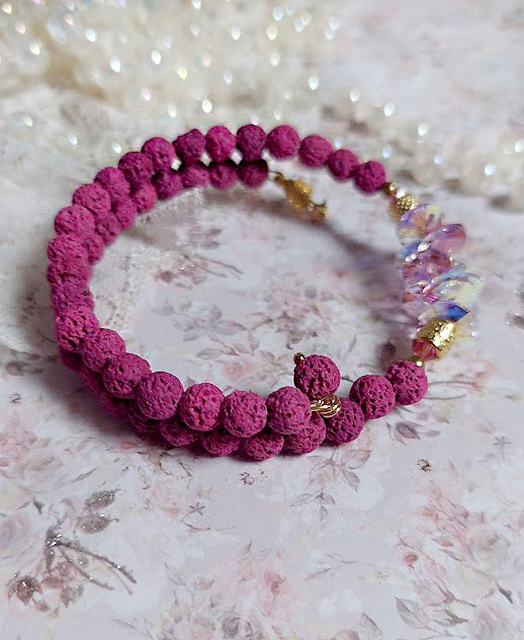 Bracelet bohème chic en pierres de lave rose framboise.