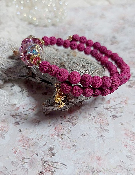 Bracelet bohème chic en pierres de lave rose framboise.