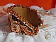 Bracelet Lady in Orange manchette Haute Couture brod&eacute; sur cuir avec cabochons en cristal, facettes, gouttes, perles nacr&eacute;es, rocailles aux couleurs Orange, Jaune, Or, Marron pour un style contemporain