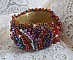 Bracelet manchette artisanal brodé de perles, améthyste et cristaux.