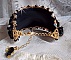 Bracelet Noir Sacr&eacute; Haute Couture brod&eacute; avec des cristaux : navette, h&eacute;lix Bead,, toupies, breloque fleur strass&eacute;e,  perles rondes nacr&eacute;es Verre et rocailles. Les couleurs sont le Noir, Blanc et Dor&eacute;