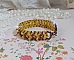 Bracelet Soleil mont&eacute; avec des facettes en verre de boh&egrave;me aux couleurs Topaze AB &agrave; laquelle s&rsquo;ajoute des perles rondes nacr&eacute;es Gold et Maron o&ugrave; elles s&rsquo;entrelacent avec les rocailles Dor&eacute;es satin&eacute;es